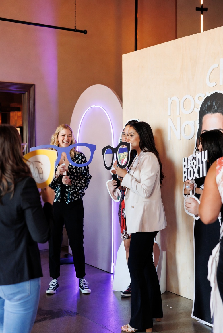 Photo booth with custom handheld signage